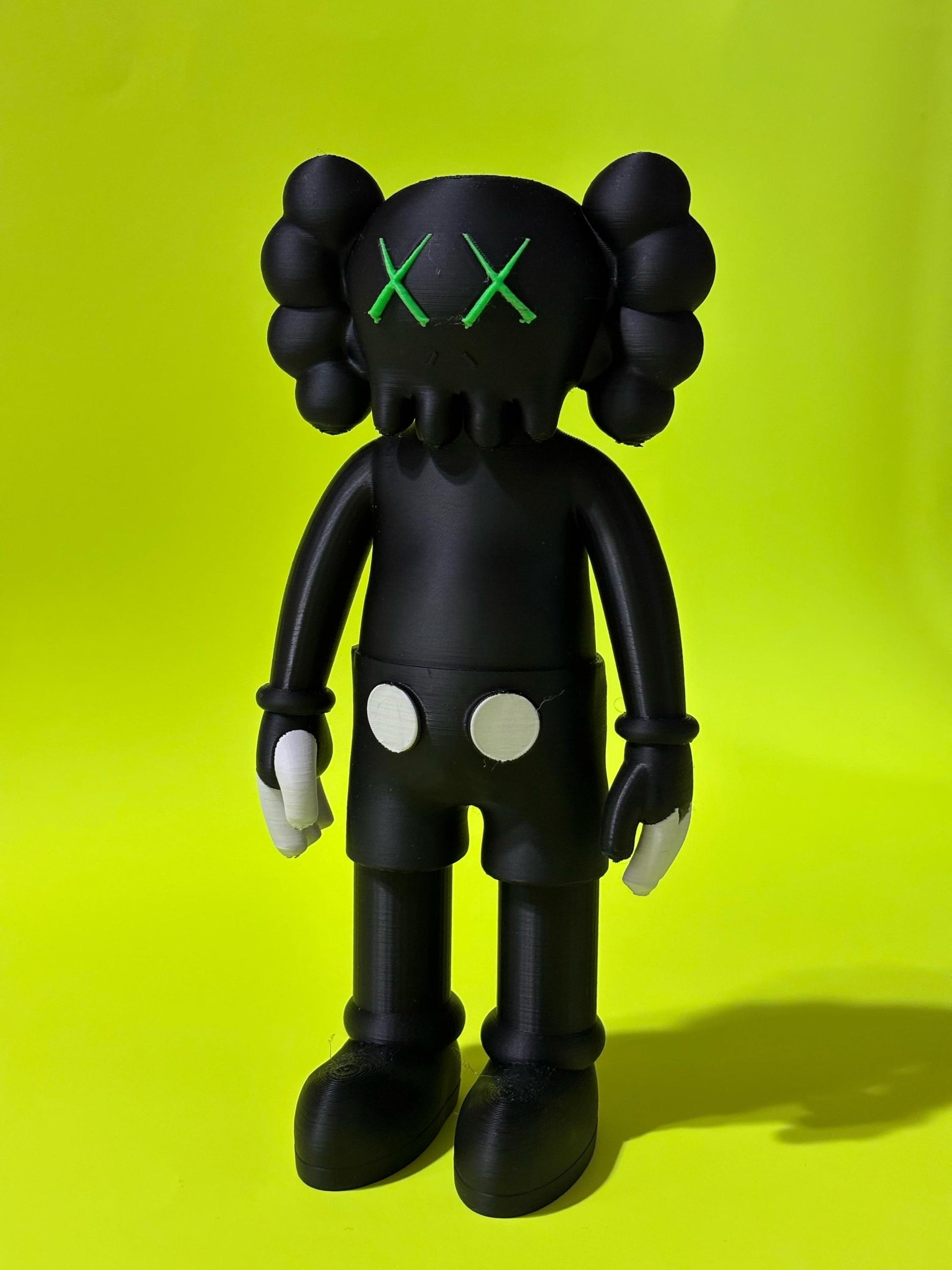 Black KAWS-Inspired Art Toy – Standing Designer Figurine with Green Eyes