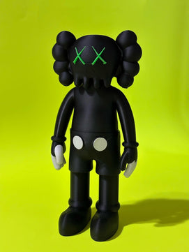 Black KAWS-Inspired Art Toy – Standing Designer Figurine with Green Eyes